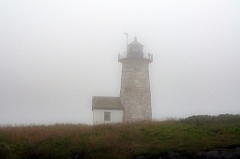 Libby Island Lighthouse Tower on Hilltop in Dense Fog